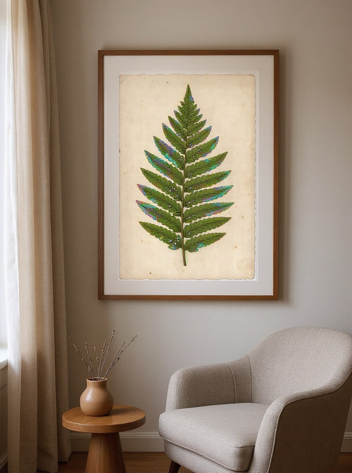 Botanical Study of the Aurora Fern, framed in oak with an ivory mat, hanging in a warm reading room